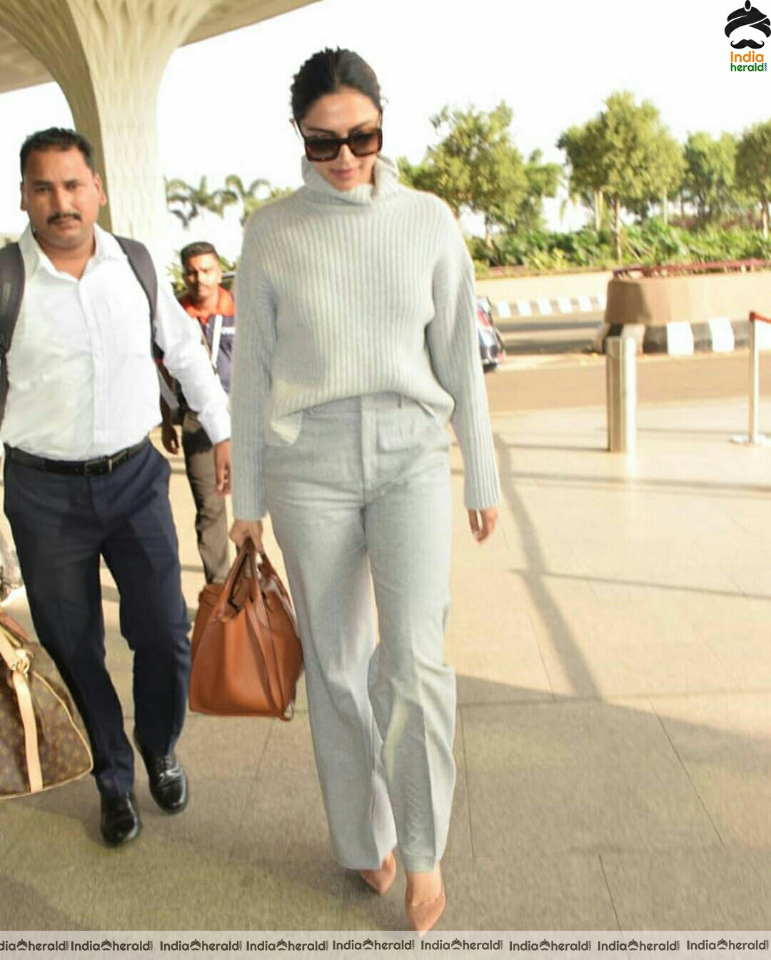 Deepika in her Winter outfit at Mumbai Airport