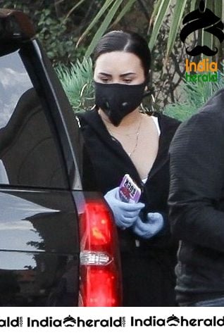Demi Lovato Wears a Corona Virus mask as she shops at Erewhon in Los Angeles