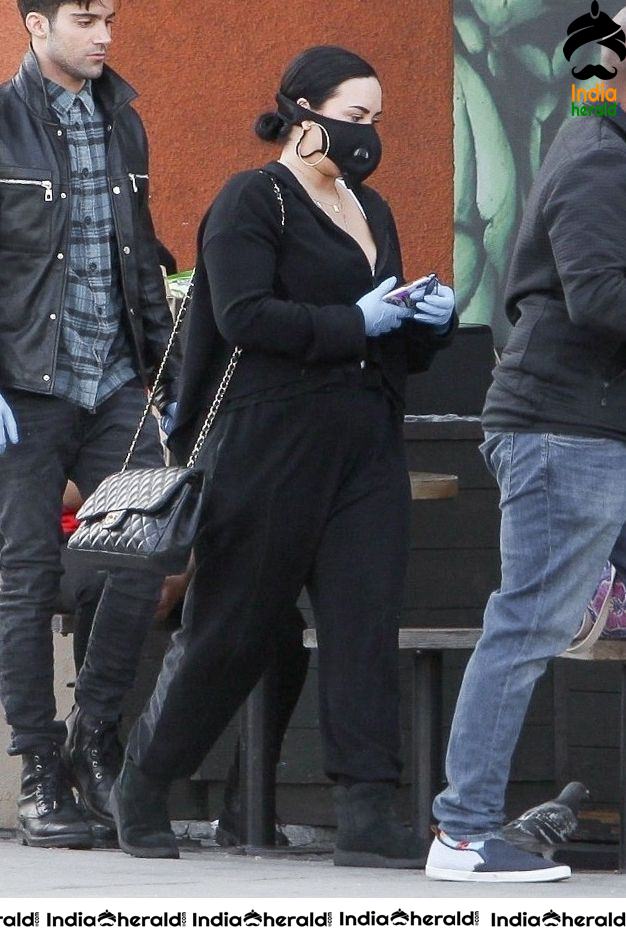 Demi Lovato Wears a Corona Virus mask as she shops at Erewhon in Los Angeles