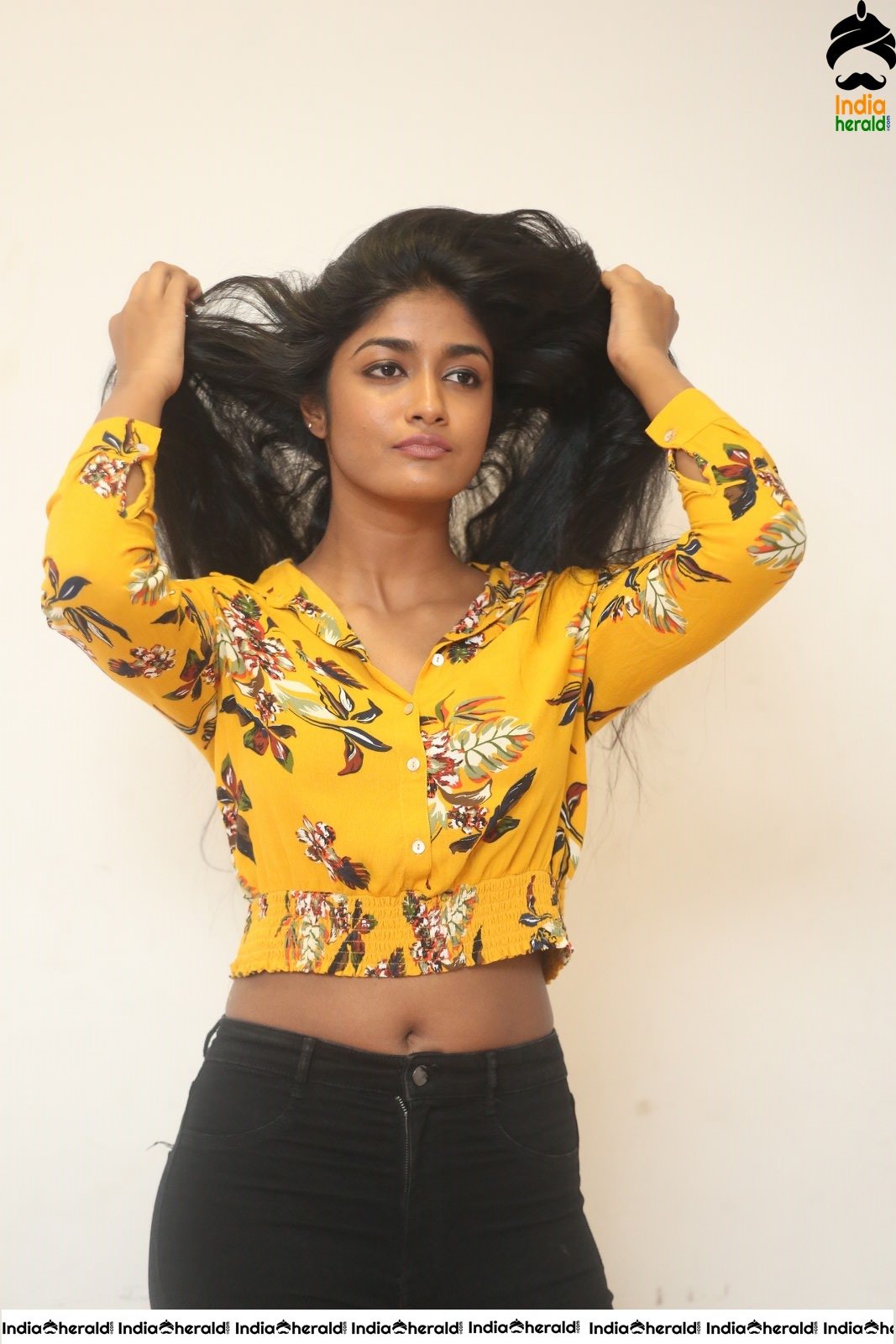Dimple Hayathi Latest Hot Teasing Navel Photos in Top and Denim Bottom