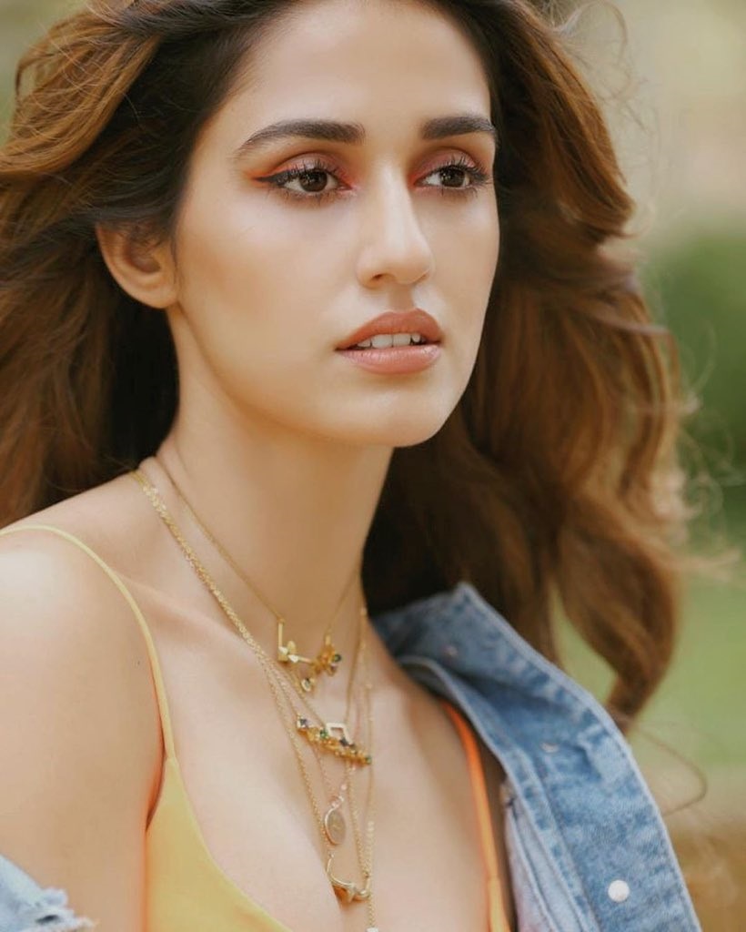 Disha Patani Raises The Temptations In A Sleeveless Orange Top And Torn Denim Coat