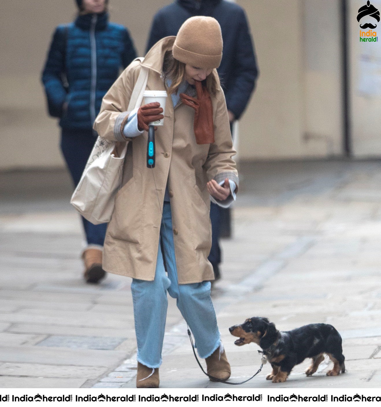 Emilia Clarke Takes her dog for a stroll as she steps out for a coffee in London