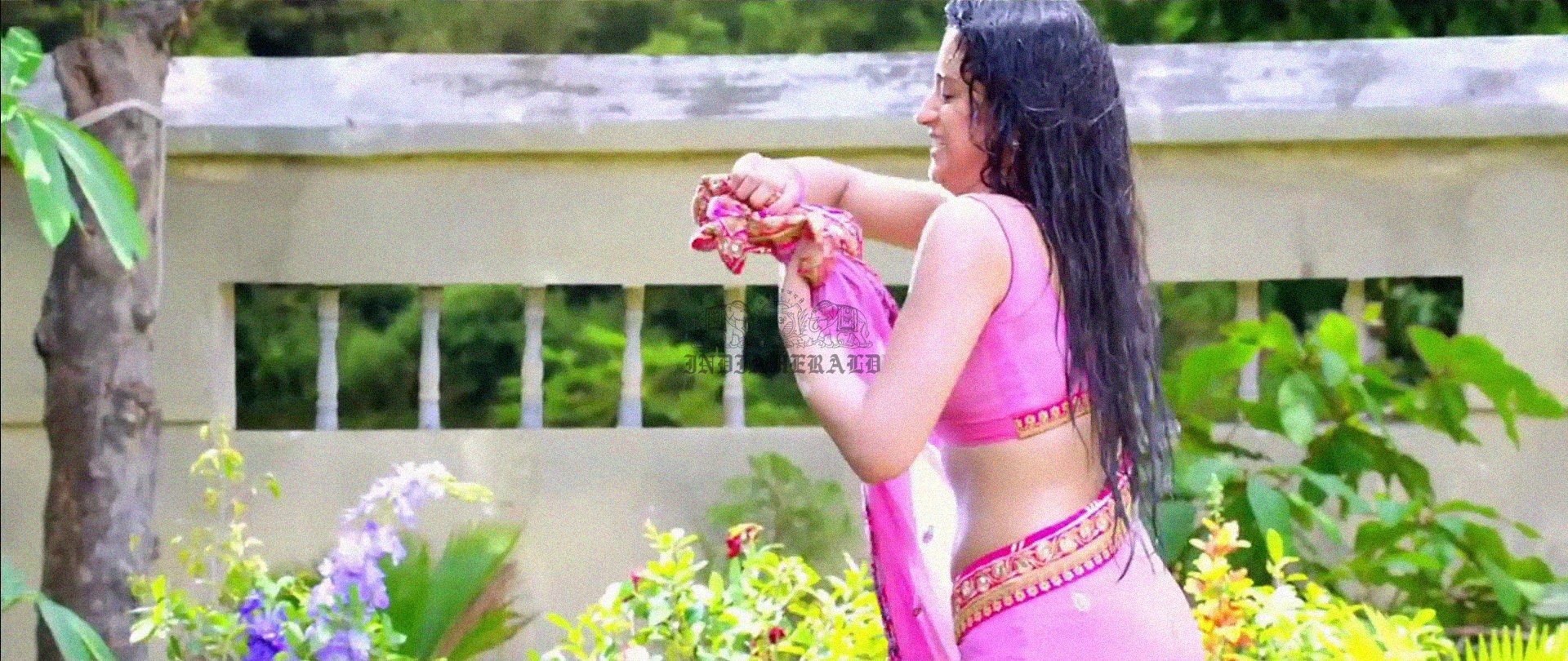 Hottest Photos of Trisha Getting Wet and Stripping Her Saree Set 2