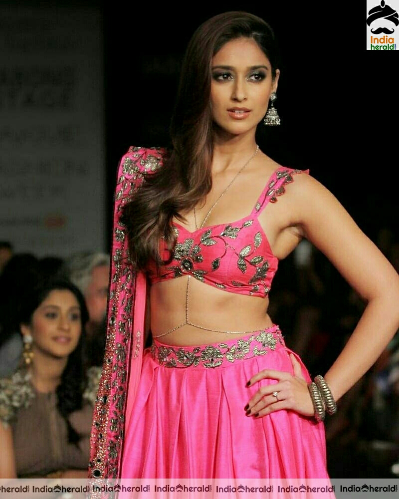 Ileana shows her slim waist and cleavage in these photos