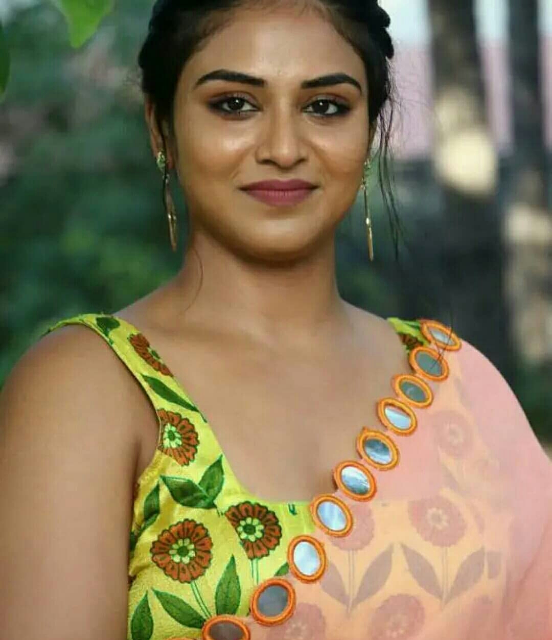 Indhuja Ravichandran Oozing Sex Appeal In Transparent Orange Saree