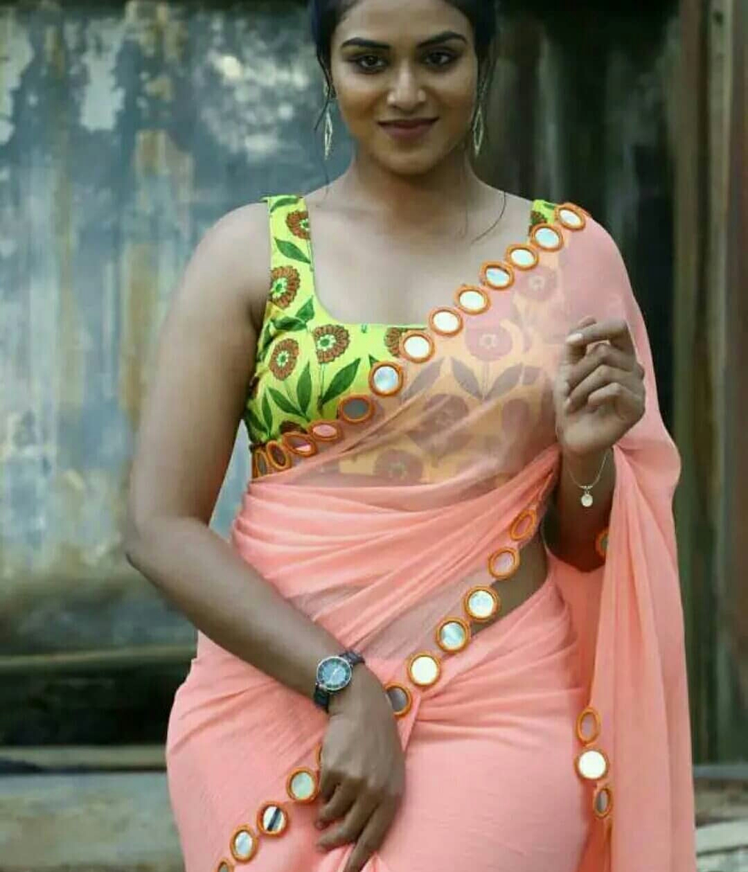 Indhuja Ravichandran Oozing Sex Appeal In Transparent Orange Saree