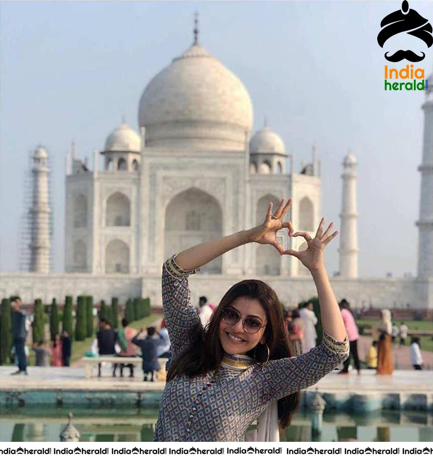 Kajal Aggarwal Showing Symbol Of Love Before Taj Mahal