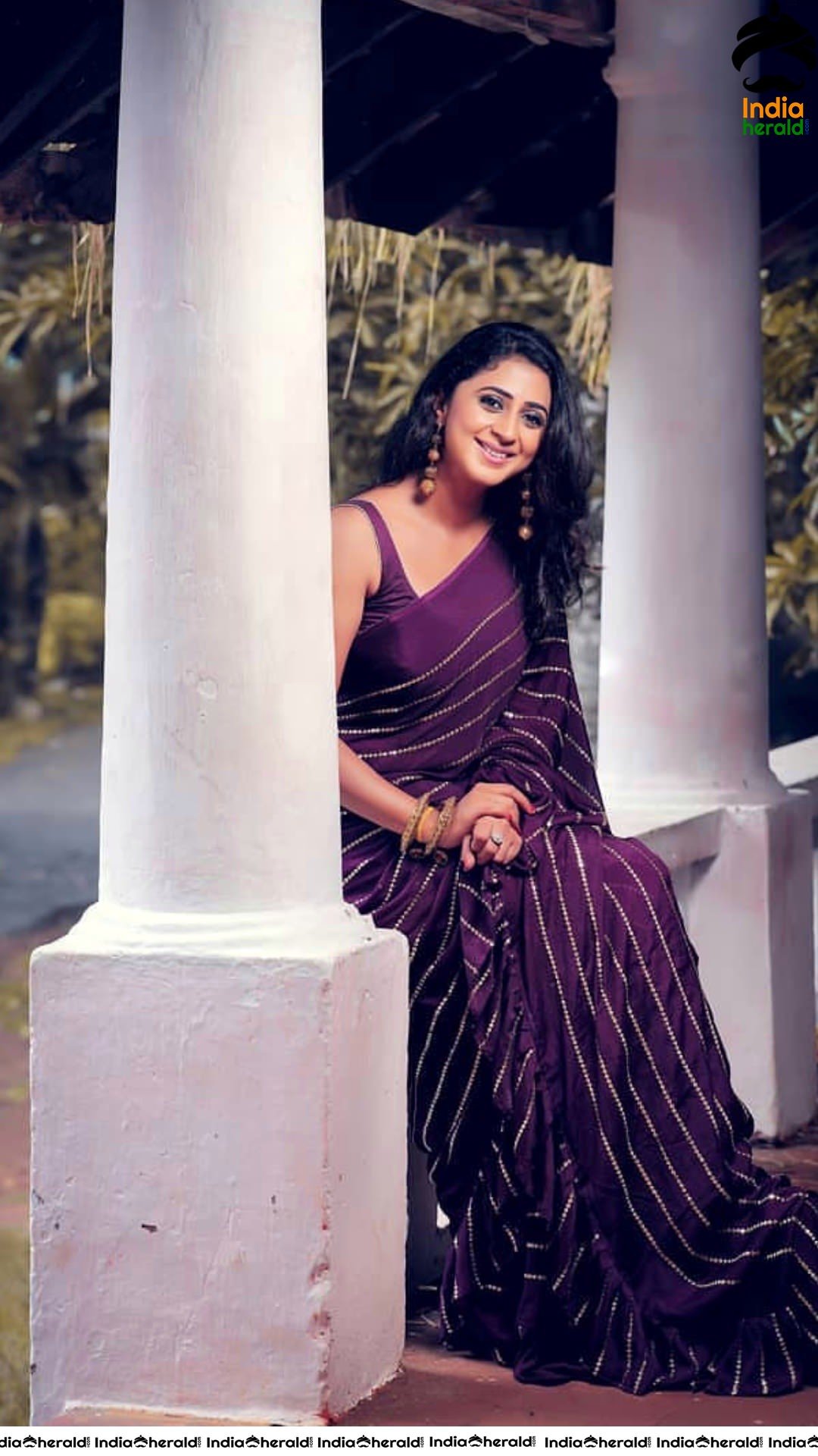 Kaniha Hot Stills in Maroon Sleeveless Blouse and Saree