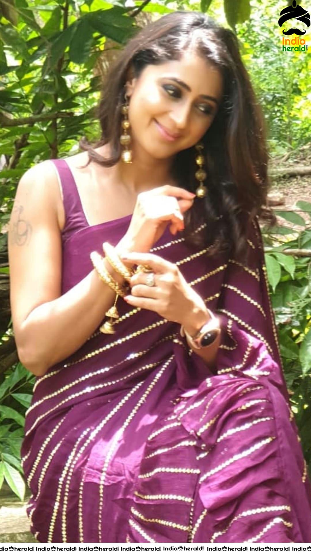 Kaniha Hot Stills in Maroon Sleeveless Blouse and Saree