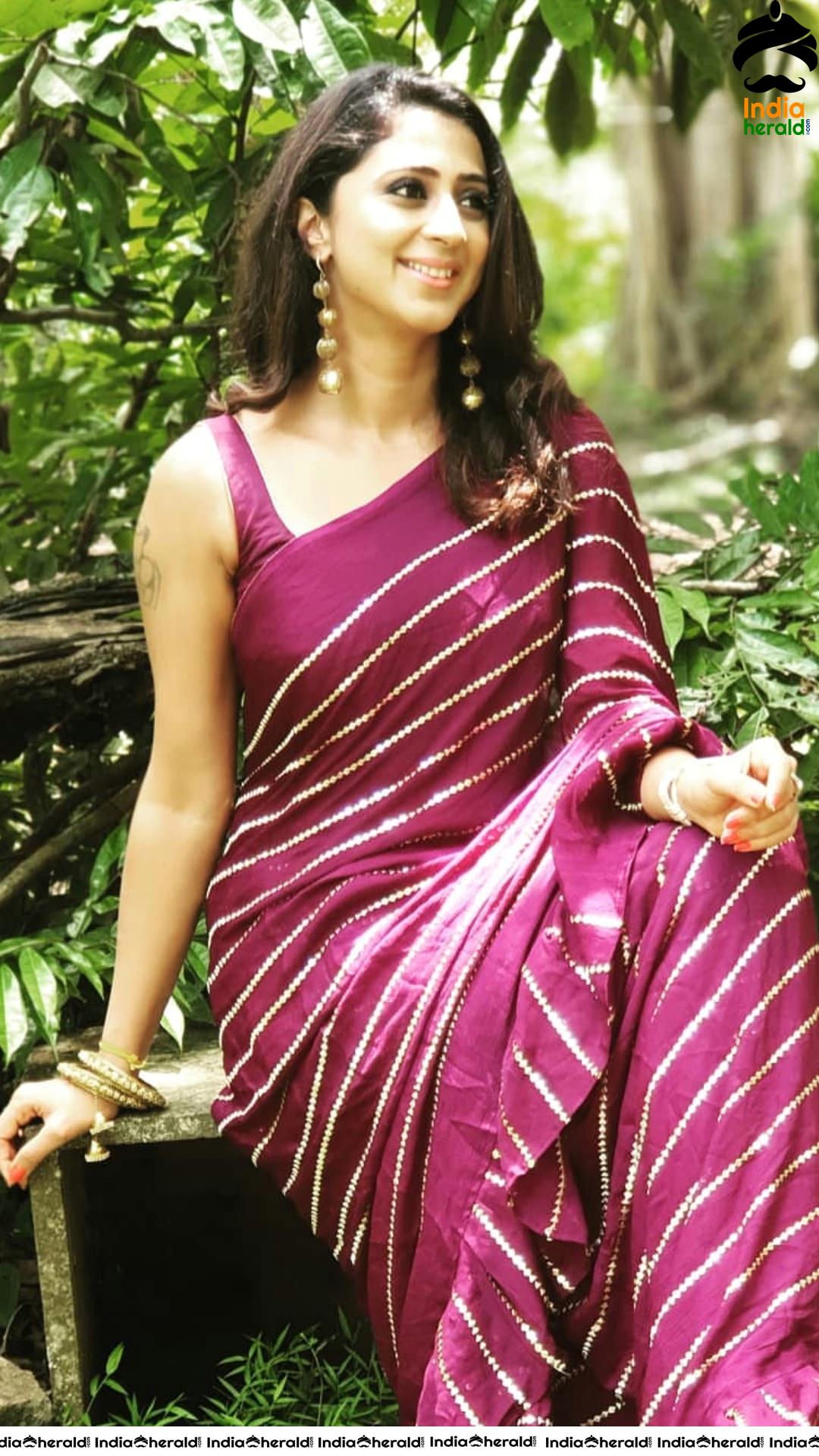 Kaniha Hot Stills in Maroon Sleeveless Blouse and Saree