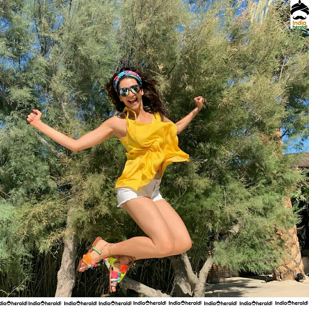 Karishma Tanna Graceful In Yellow Colour Short Dress