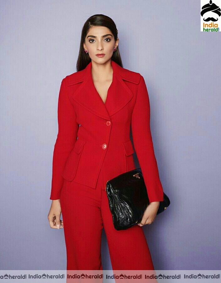 Karishma Tanna Stylish Stills In Red Coat