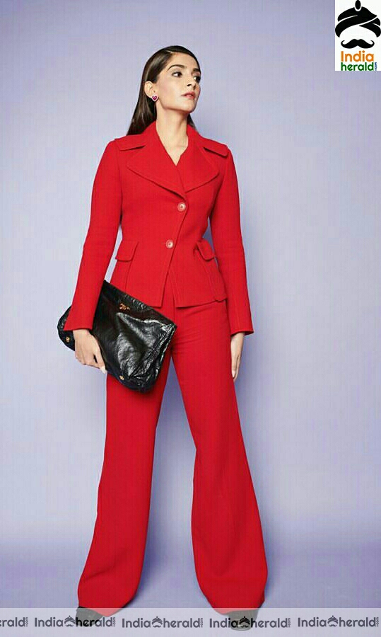 Karishma Tanna Stylish Stills In Red Coat