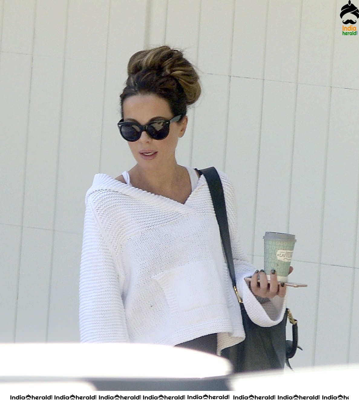 Kate Beckinsale in White Transparent Top and takes a walk at LA