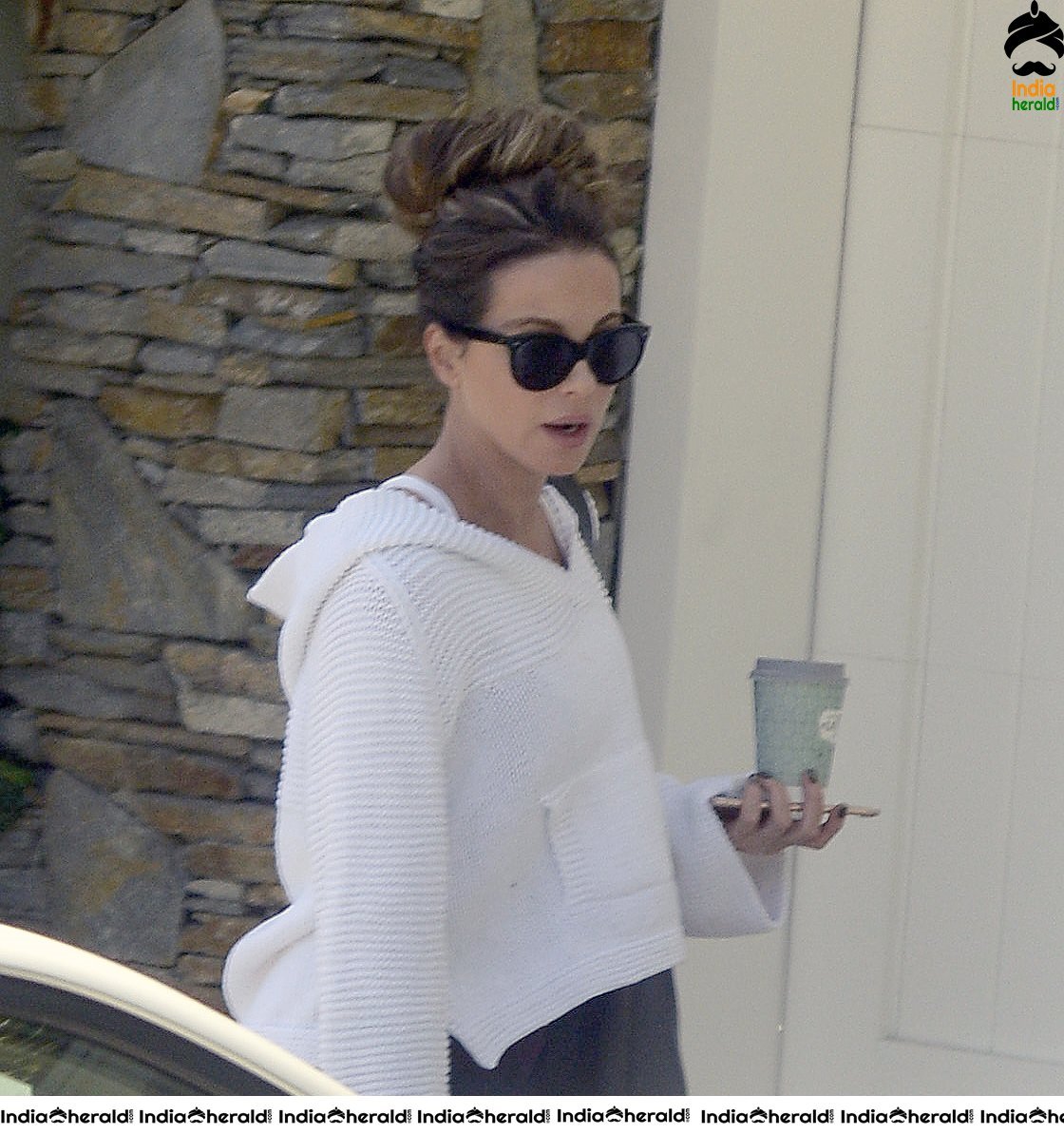 Kate Beckinsale in White Transparent Top and takes a walk at LA