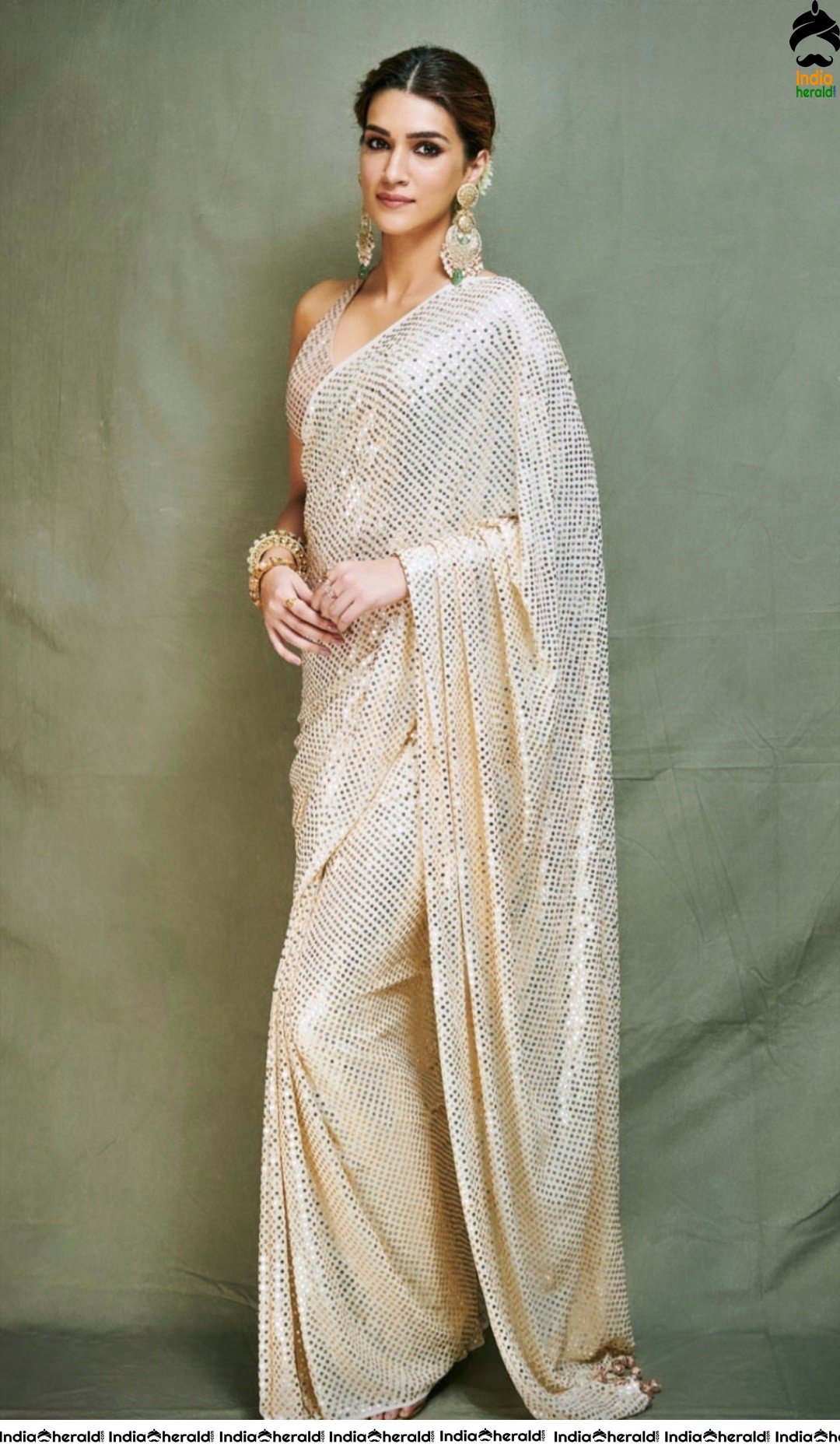 Divi Shines with Backless Saree Style