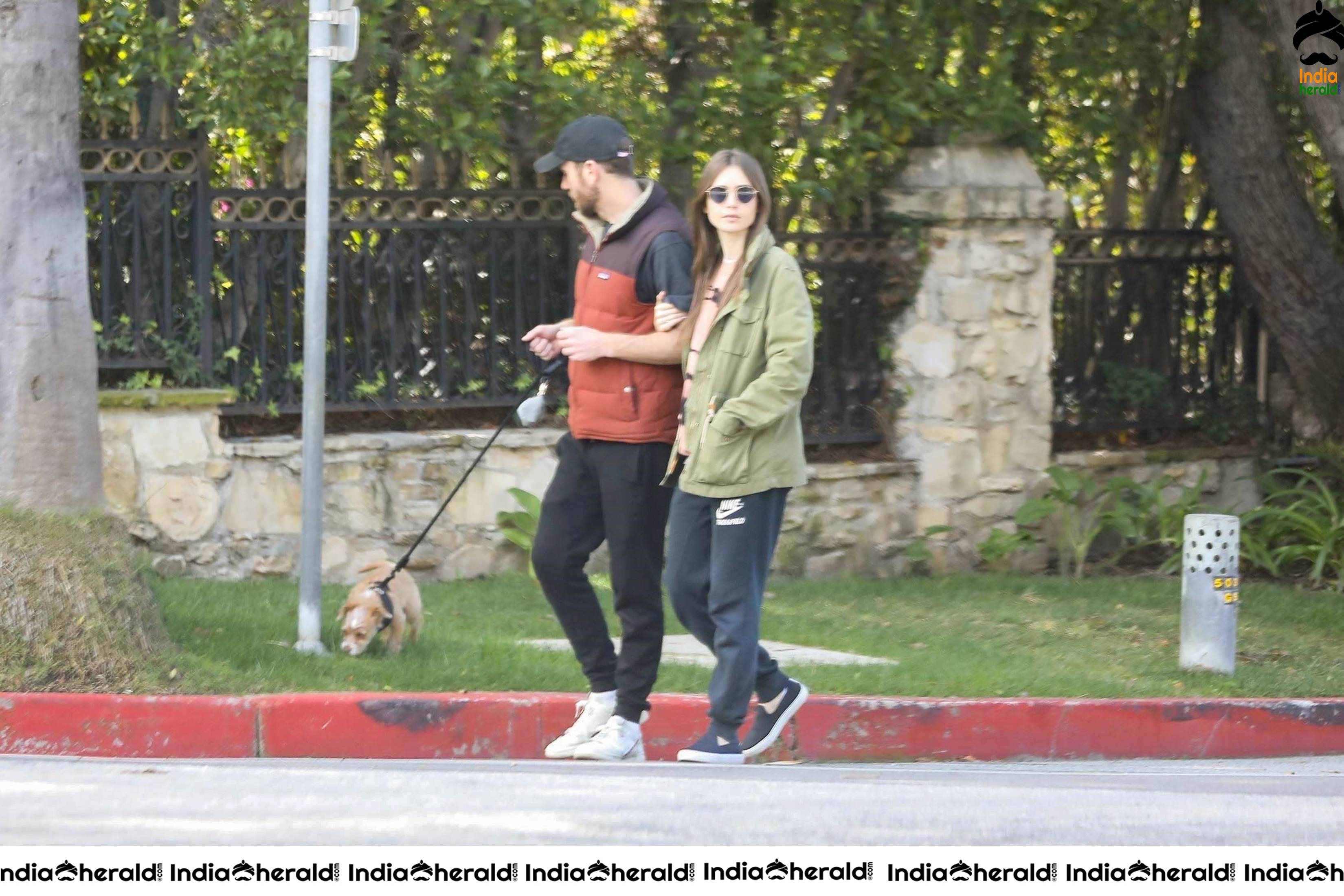 Lily Collins caught by Paparazzi while walking with her dog in Los Angeles