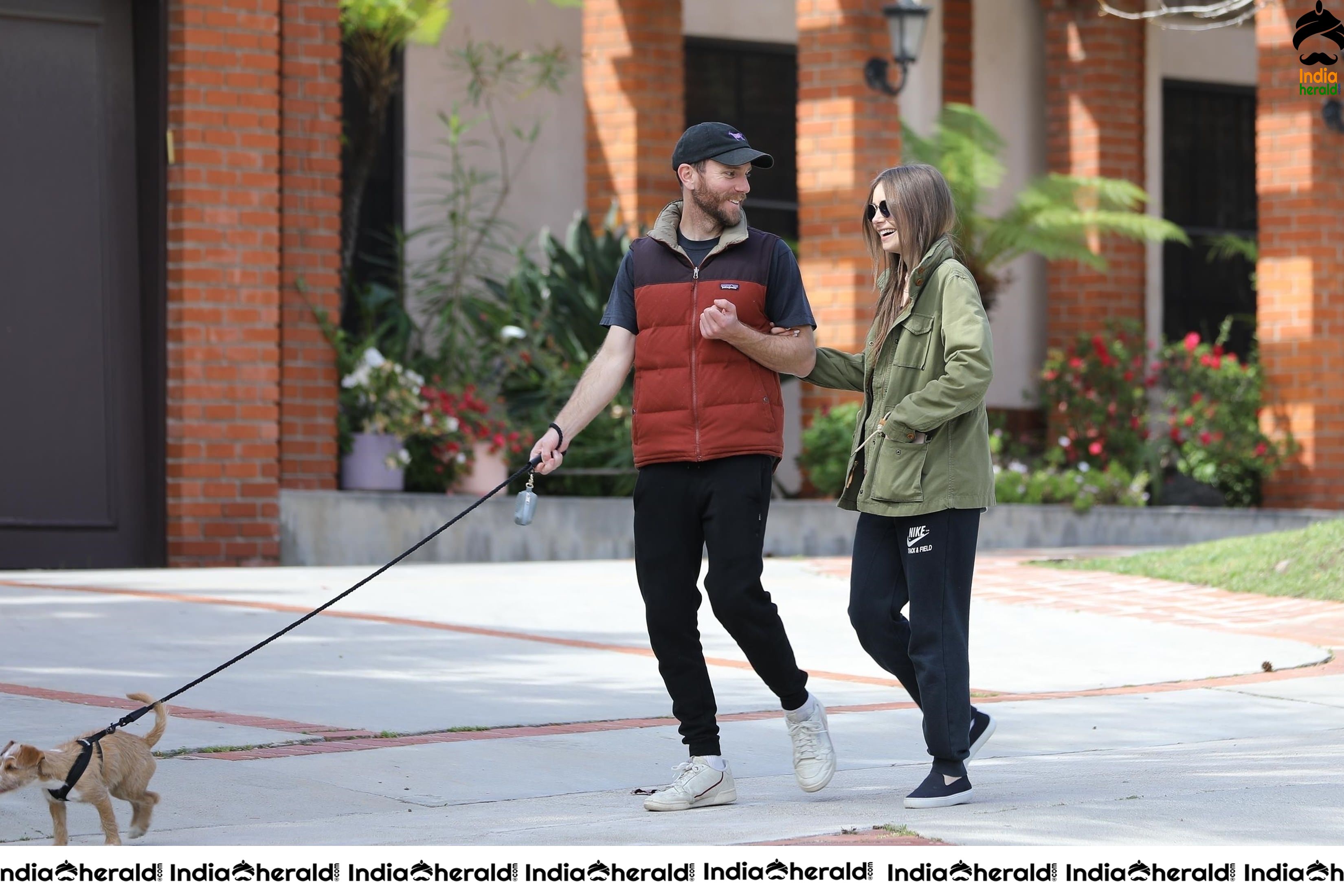 Lily Collins caught by Paparazzi while walking with her dog in Los Angeles