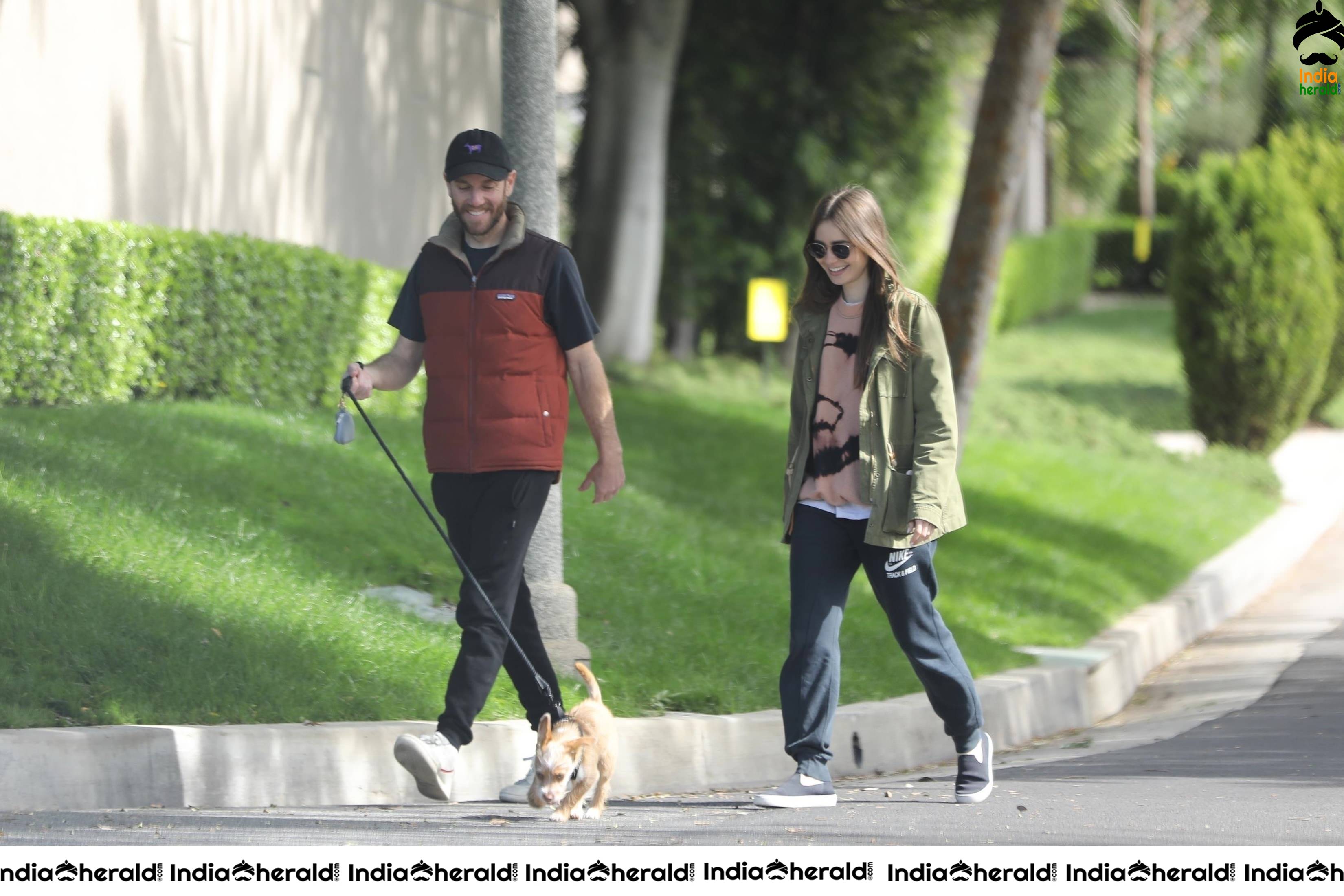 Lily Collins caught by Paparazzi while walking with her dog in Los Angeles