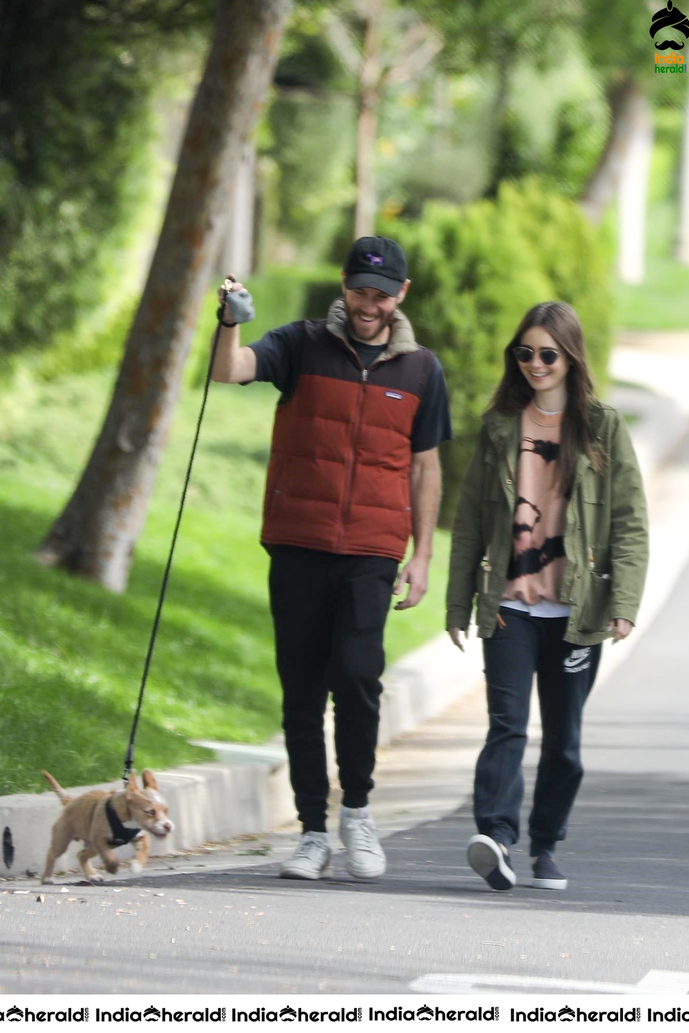 Lily Collins caught by Paparazzi while walking with her dog in Los Angeles