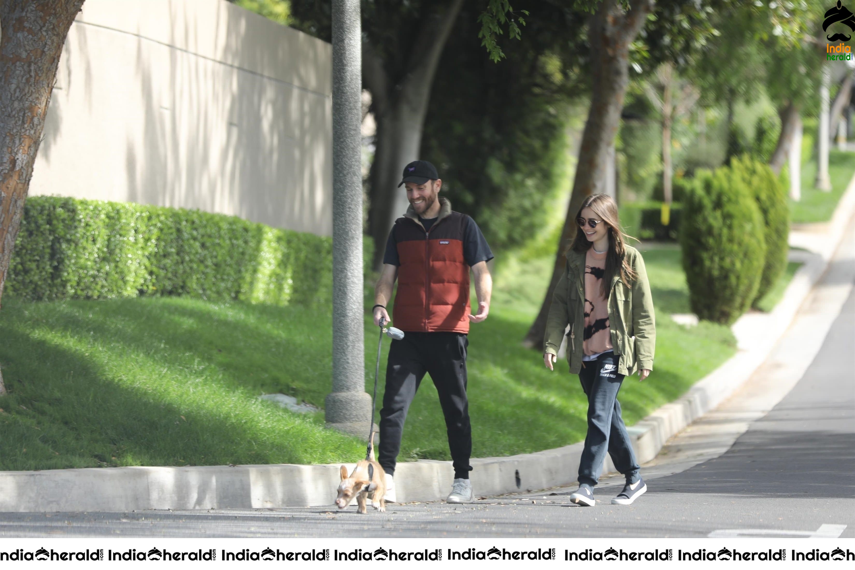 Lily Collins caught by Paparazzi while walking with her dog in Los Angeles