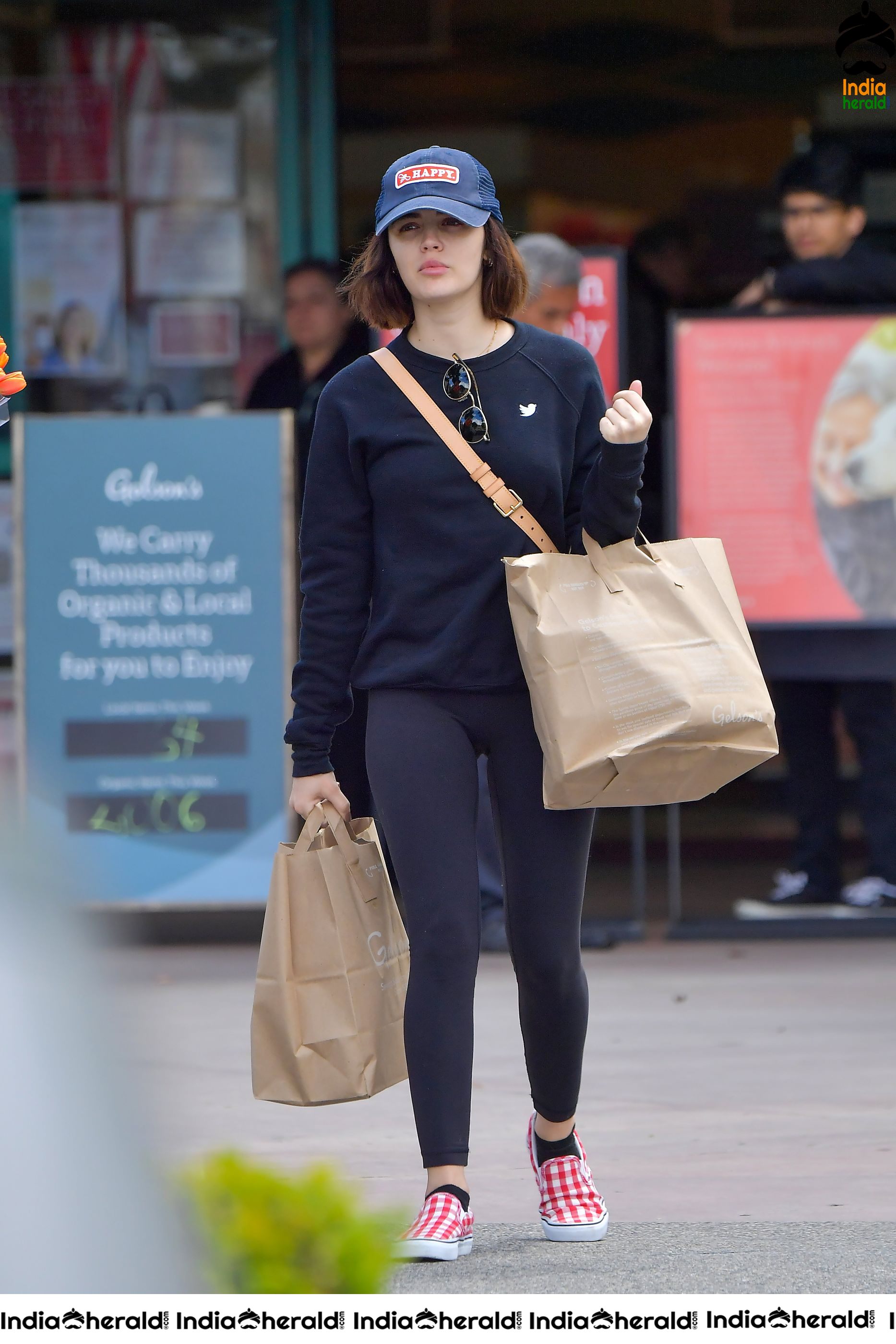 Lucy Hale keeps her social distance in mind as she shops for groceries