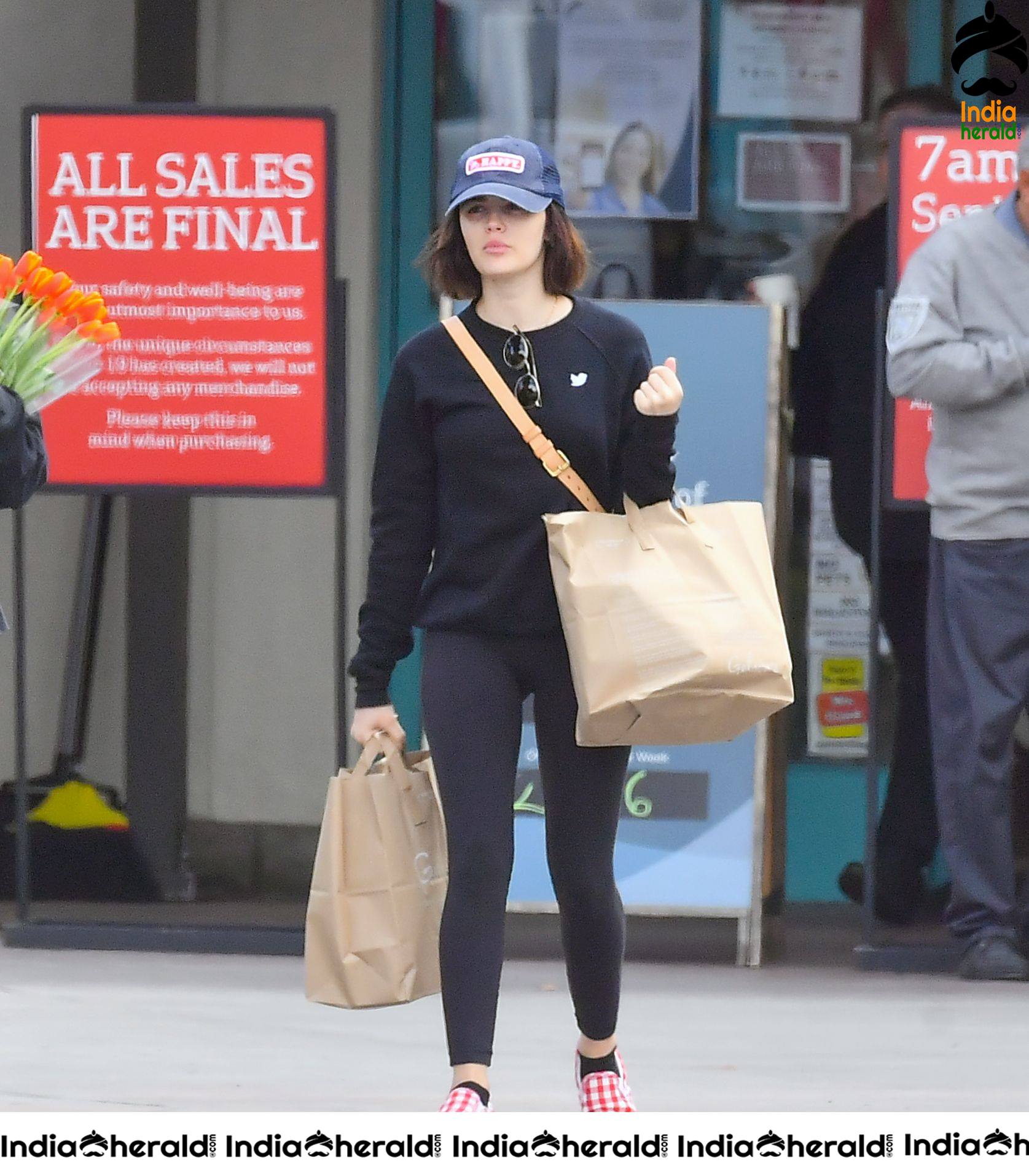 Lucy Hale keeps her social distance in mind as she shops for groceries