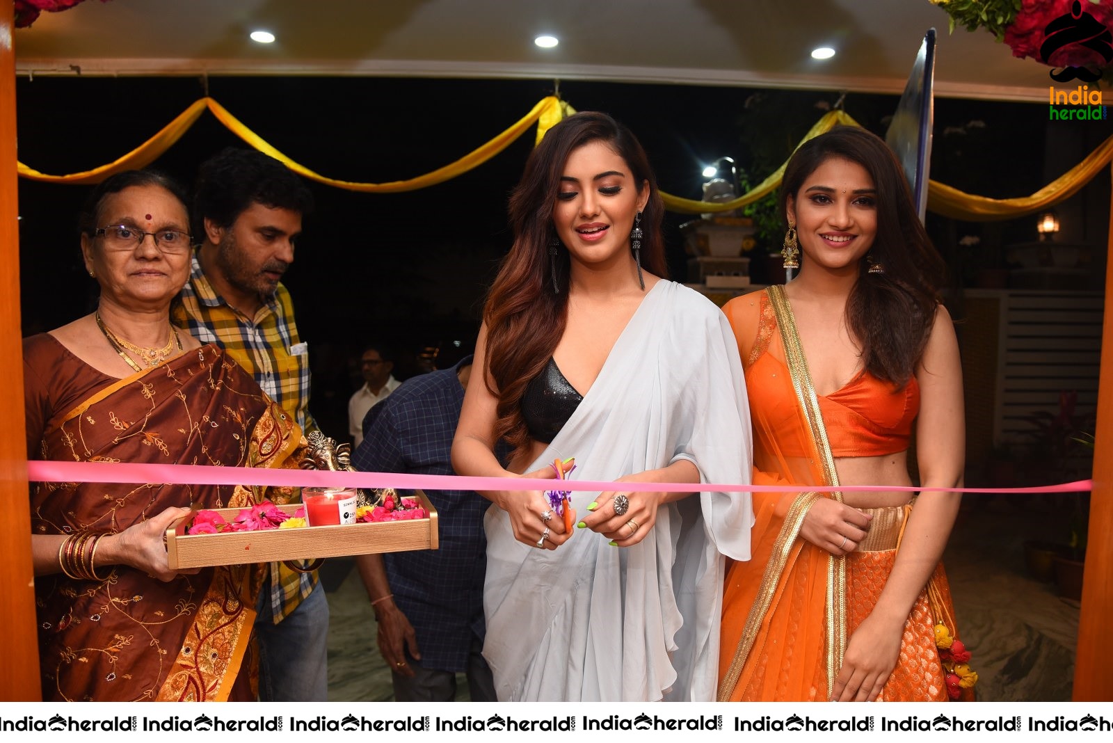 Malvika Sharma Seen in a Sexy Saree at the Ribbon Cutting moment Set 1