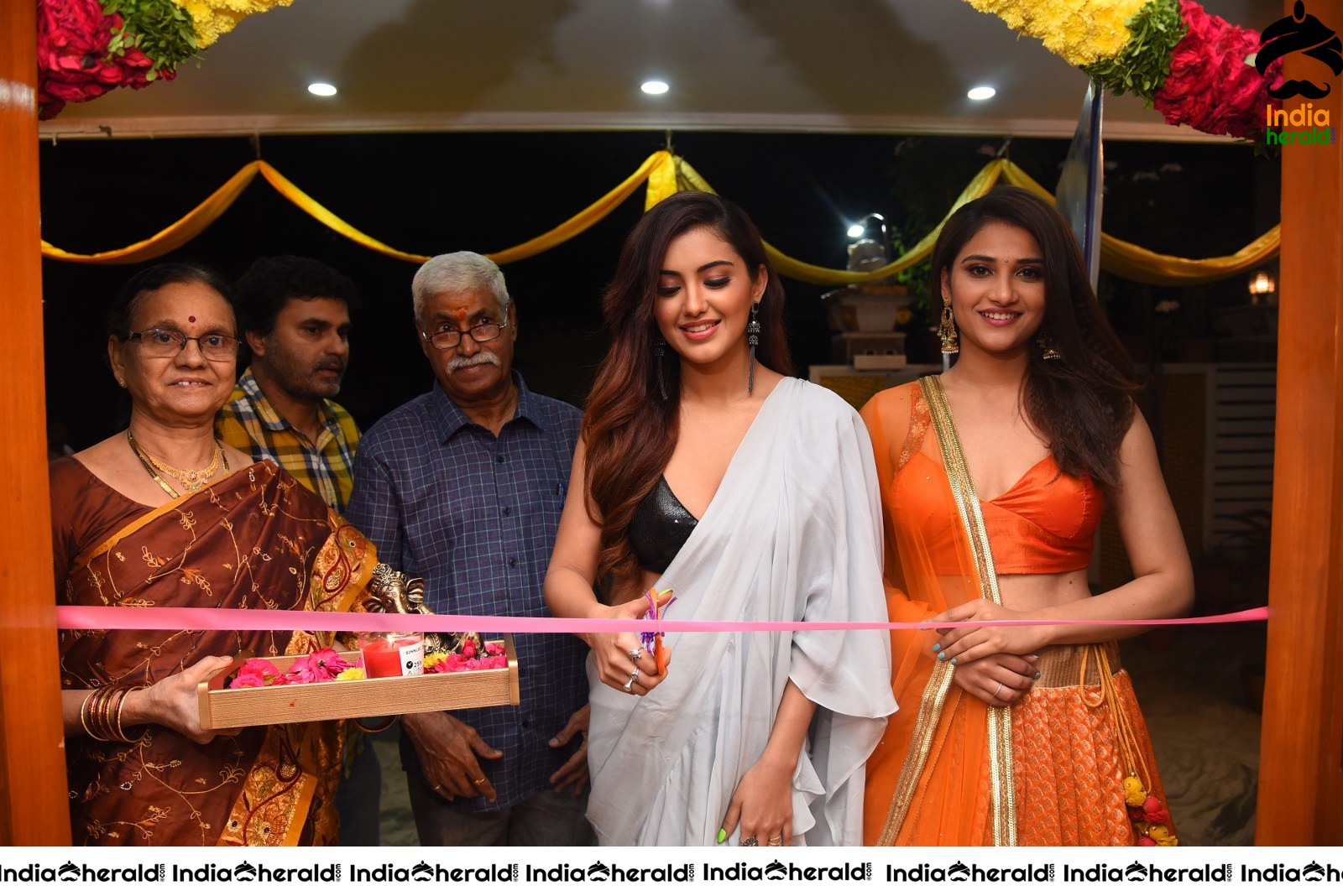 Malvika Sharma Seen in a Sexy Saree at the Ribbon Cutting moment Set 1