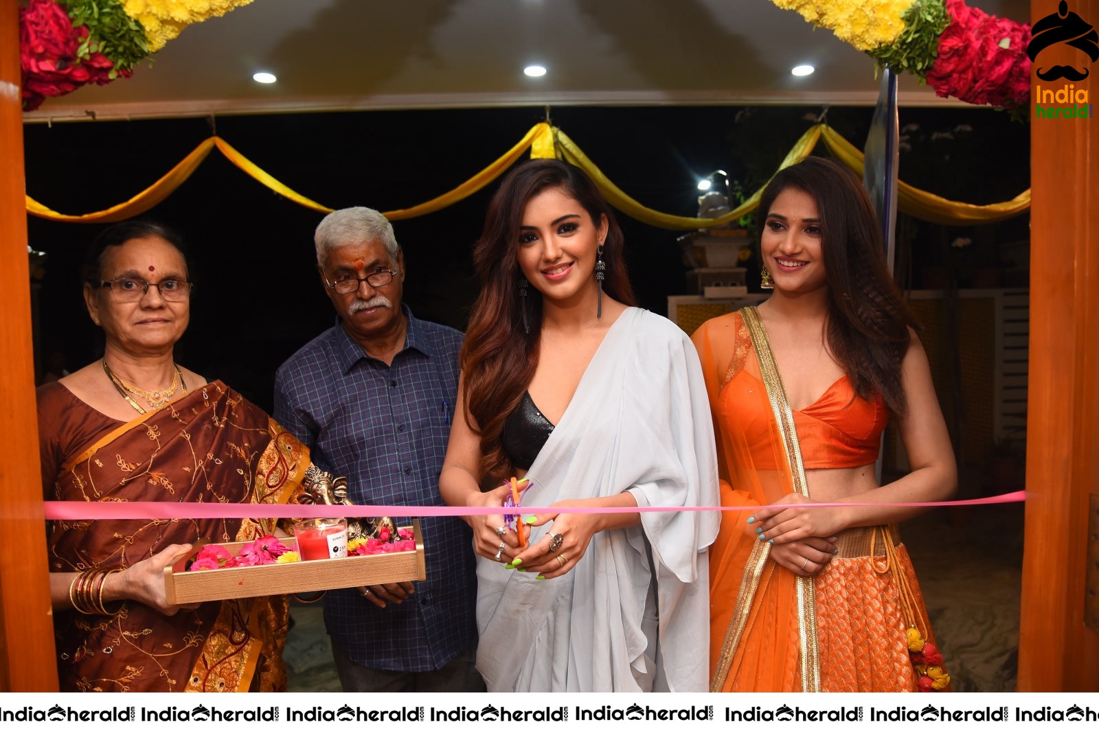 Malvika Sharma Seen in a Sexy Saree at the Ribbon Cutting moment Set 1