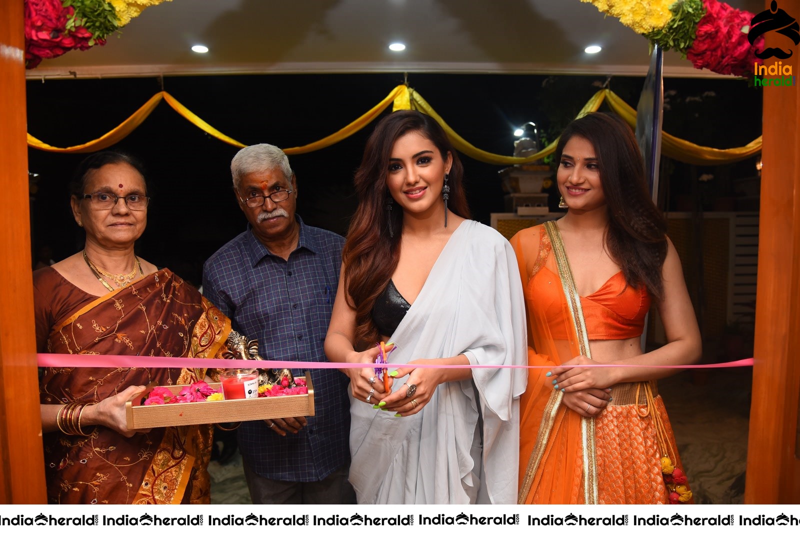 Malvika Sharma Seen in a Sexy Saree at the Ribbon Cutting moment Set 1