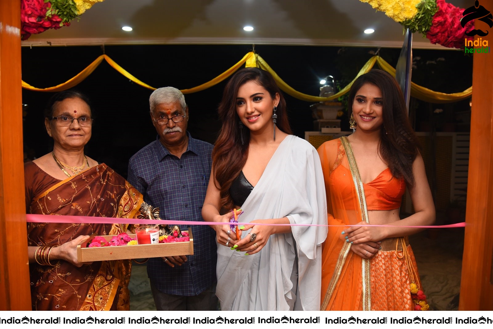 Malvika Sharma Seen in a Sexy Saree at the Ribbon Cutting moment Set 1