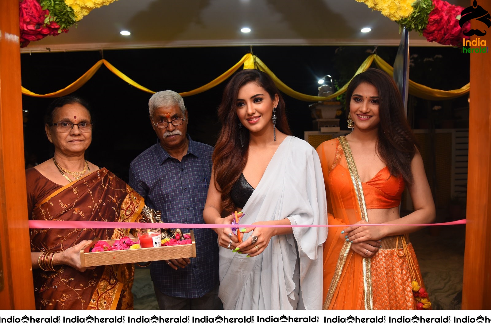 Malvika Sharma Seen in a Sexy Saree at the Ribbon Cutting moment Set 1