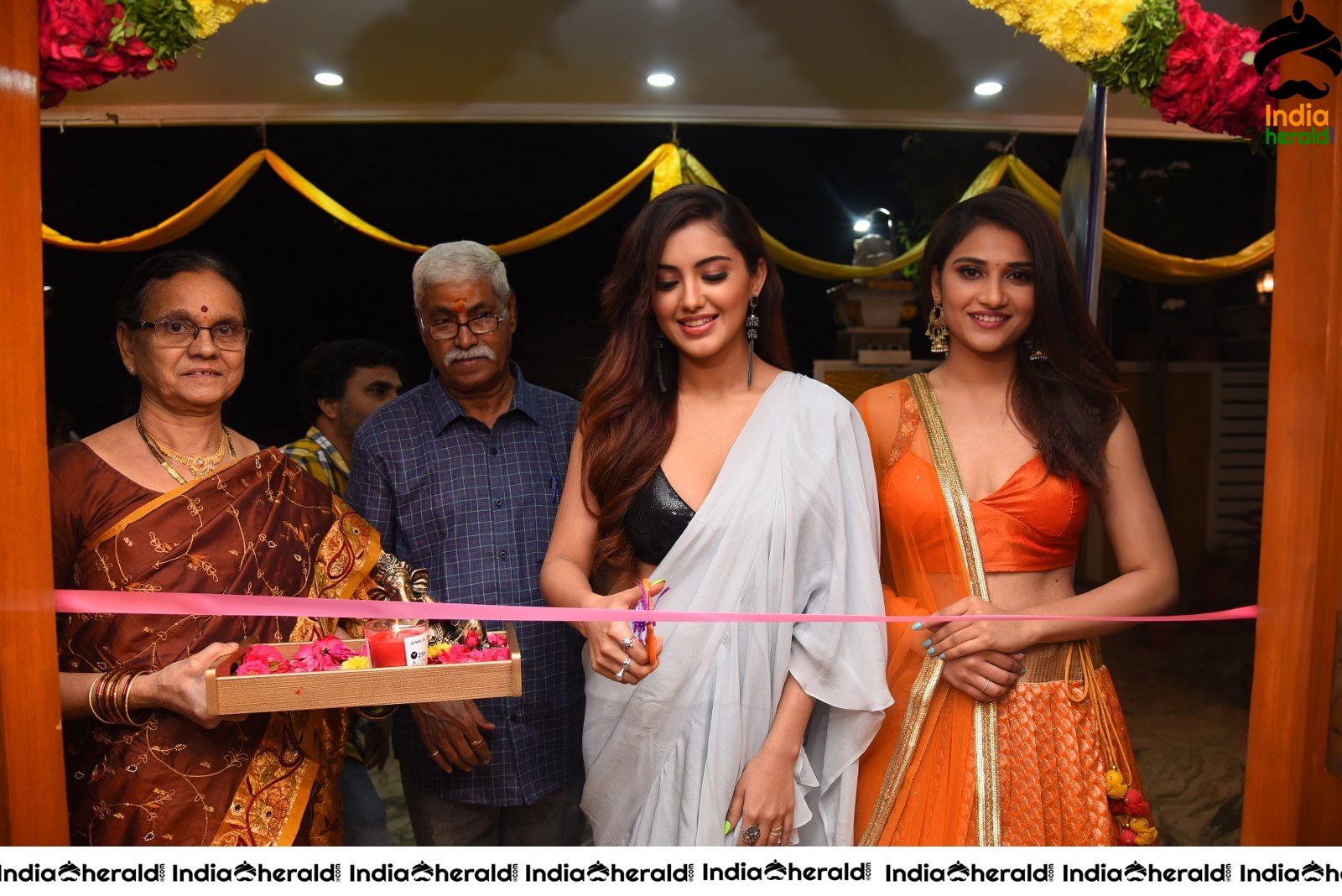 Malvika Sharma Seen in a Sexy Saree at the Ribbon Cutting moment Set 1