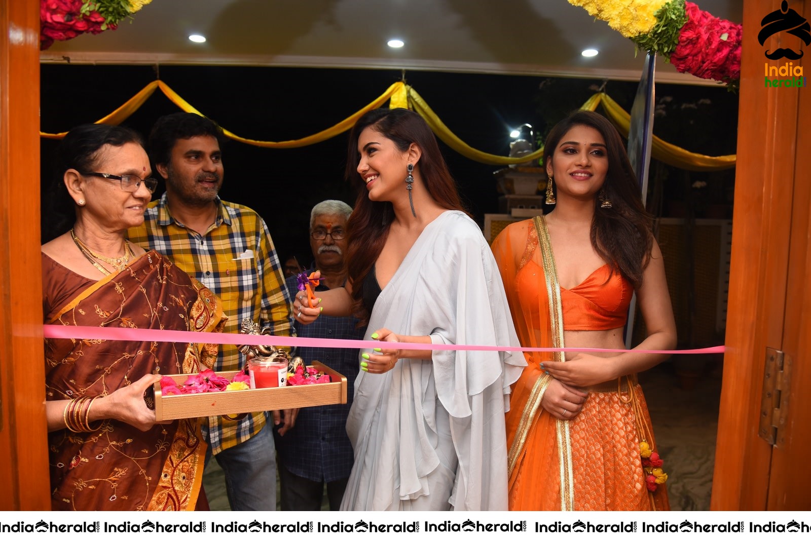 Malvika Sharma Seen in a Sexy Saree at the Ribbon Cutting moment Set 1