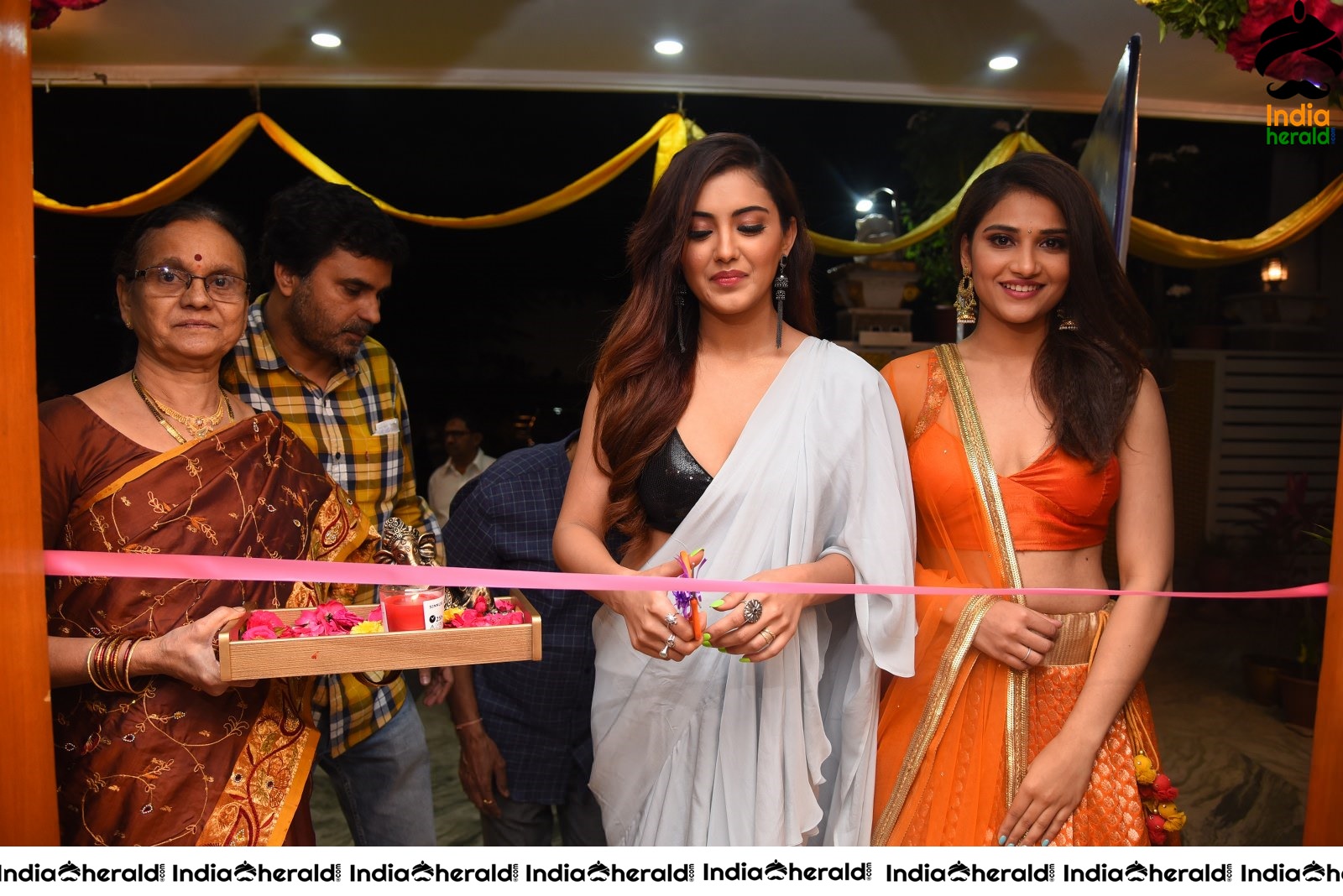 Malvika Sharma Seen in a Sexy Saree at the Ribbon Cutting moment Set 1