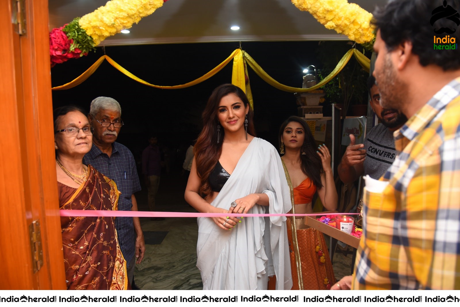 Malvika Sharma Seen in a Sexy Saree at the Ribbon Cutting moment Set 1