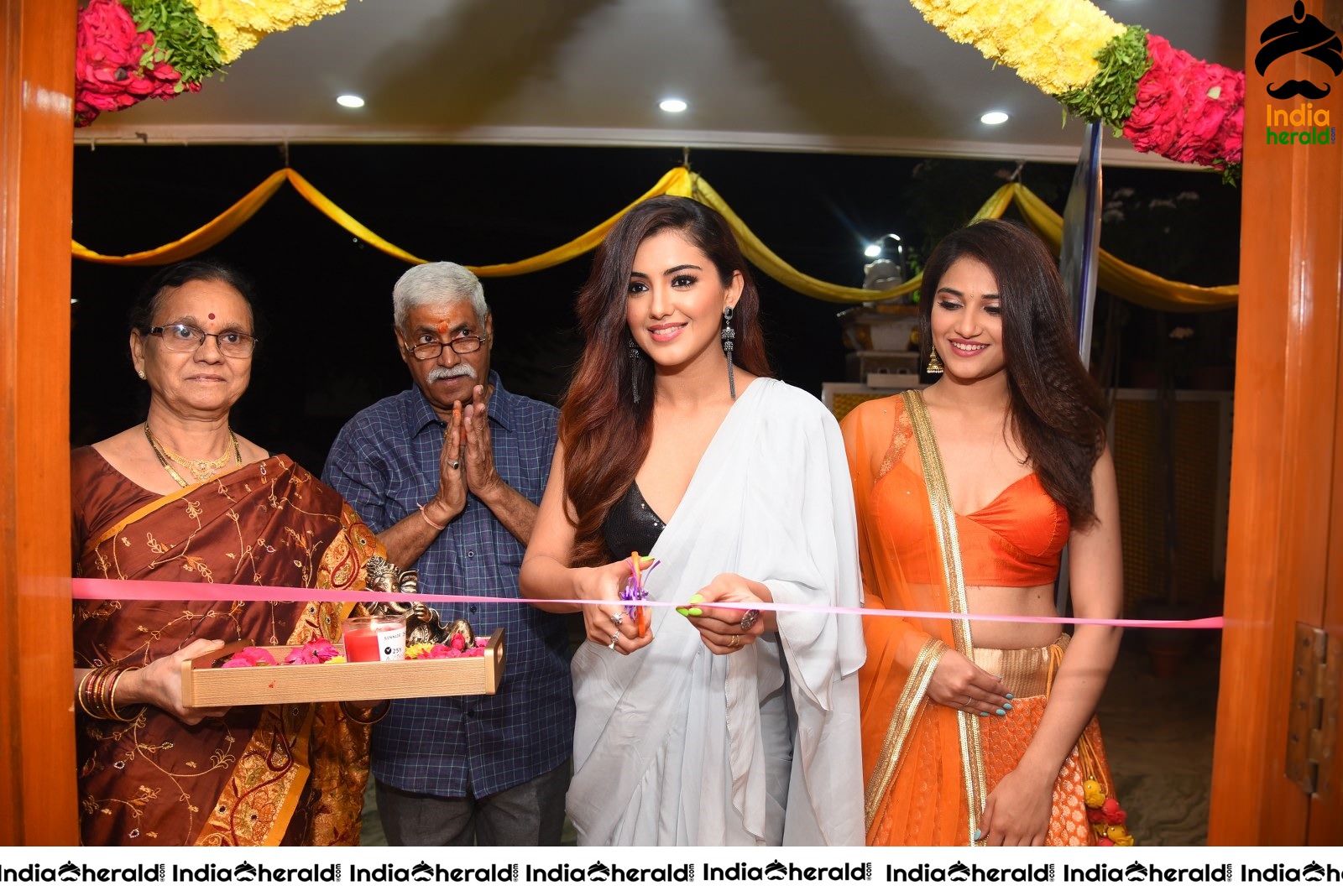 Malvika Sharma Seen in a Sexy Saree at the Ribbon Cutting moment Set 2