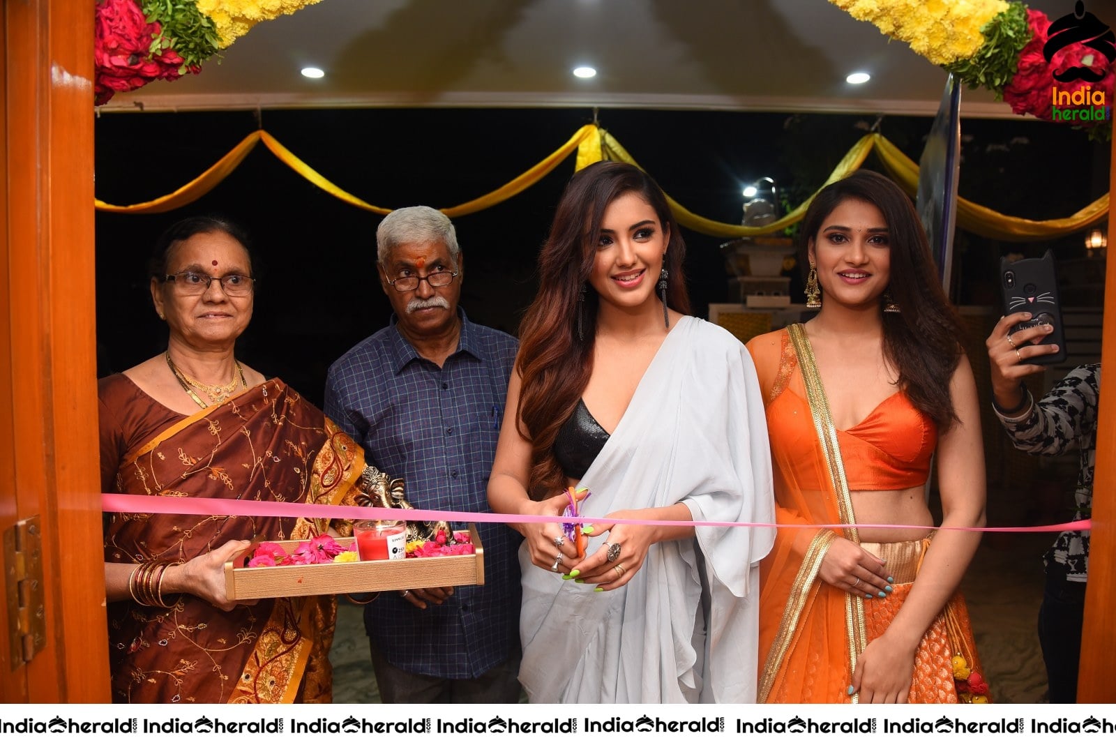 Malvika Sharma Seen in a Sexy Saree at the Ribbon Cutting moment Set 2