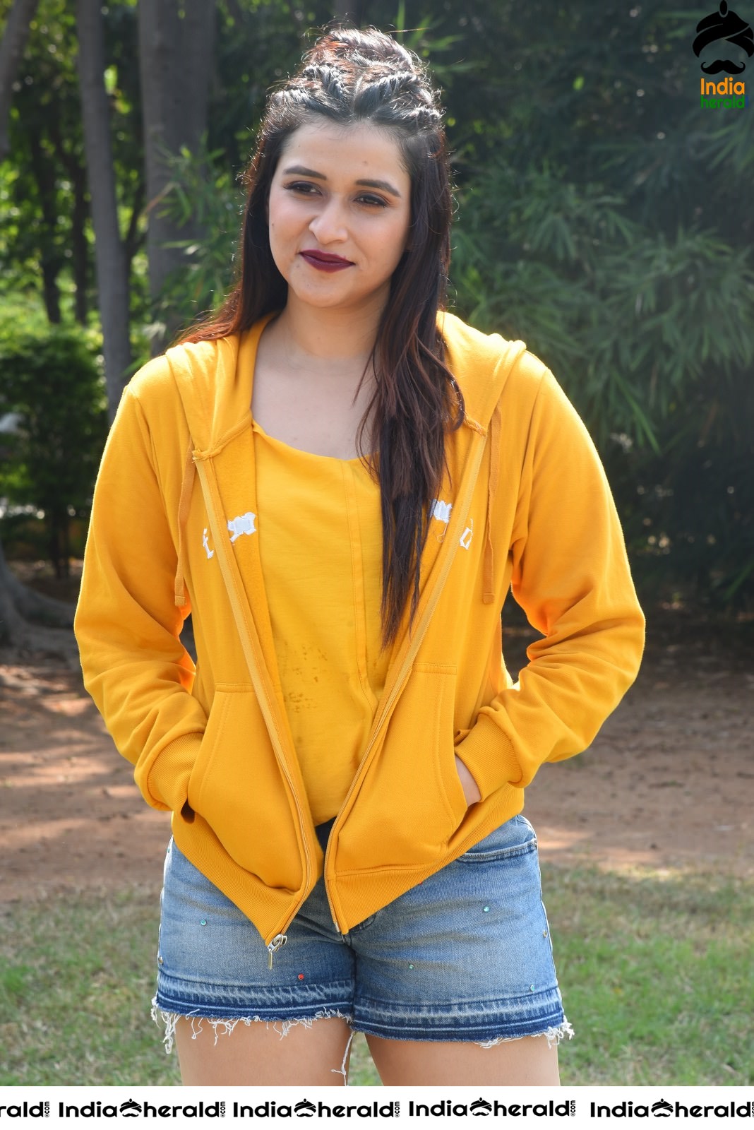 Mannara Chopra Hot Thighs Show in Sexy Shorts and Yellow Jerkin Set 2