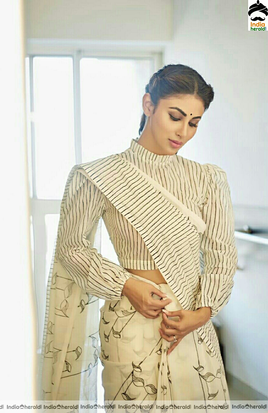 Mouni Roy Cute And Stylish Stills In Cream Saree