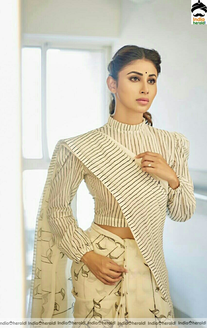 Mouni Roy Cute And Stylish Stills In Cream Saree