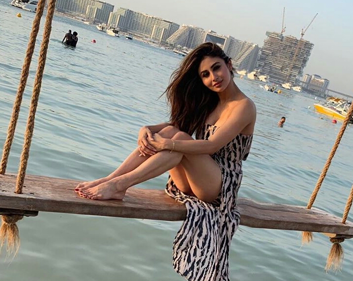 Mouni Roy Swinging Over The Waves And Shows Her Thighs