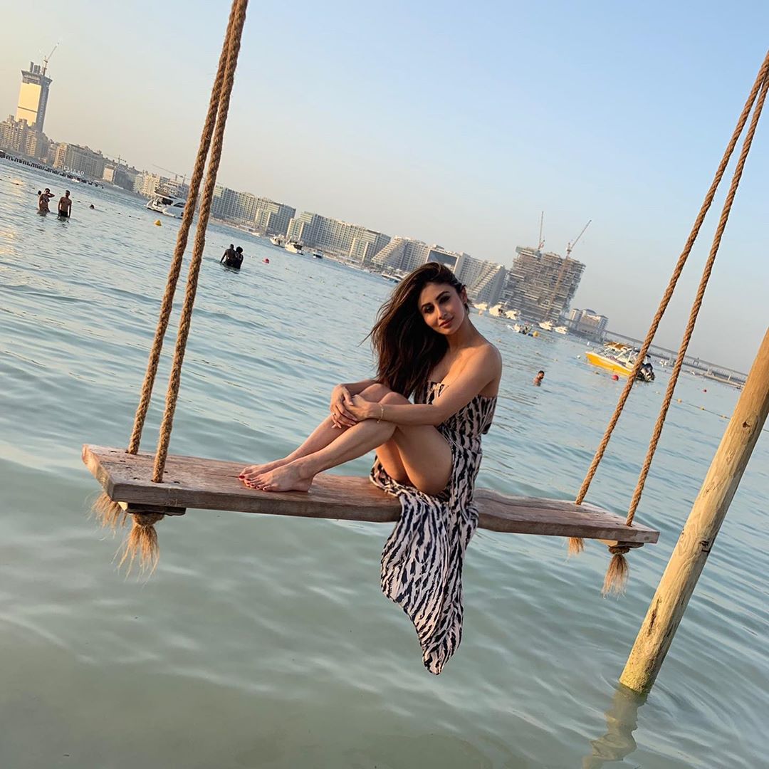 Mouni Roy Swinging Over The Waves And Shows Her Thighs
