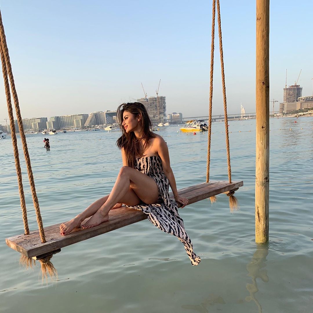 Mouni Roy Swinging Over The Waves And Shows Her Thighs