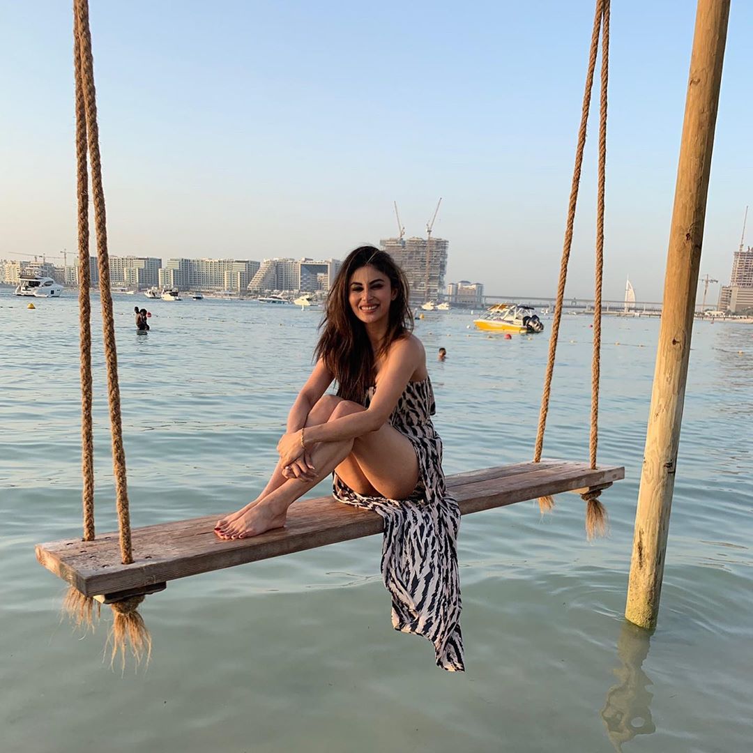 Mouni Roy Swinging Over The Waves And Shows Her Thighs