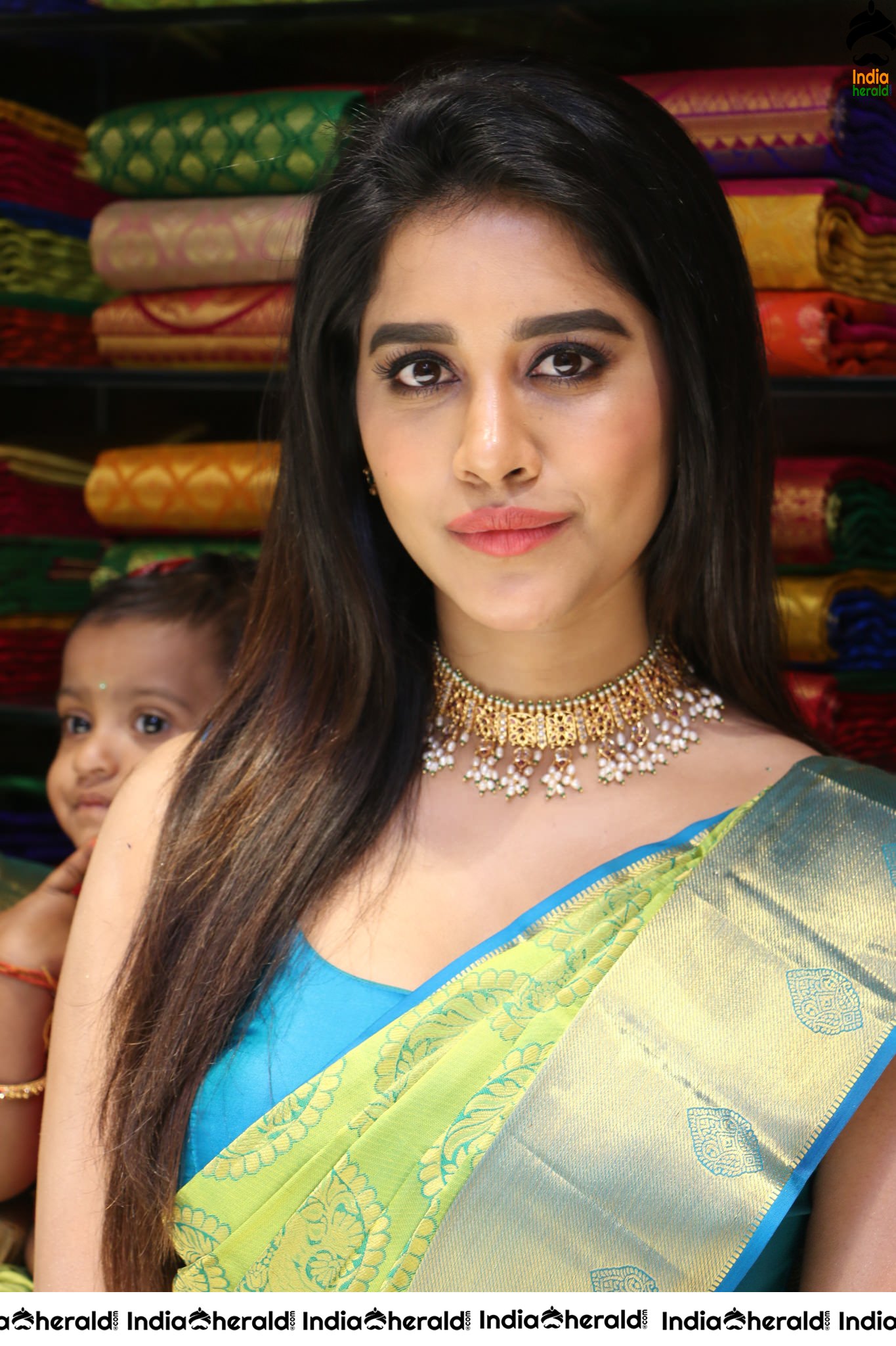 Nabha Natesh looking sexy in Saree during a Textile shop opening