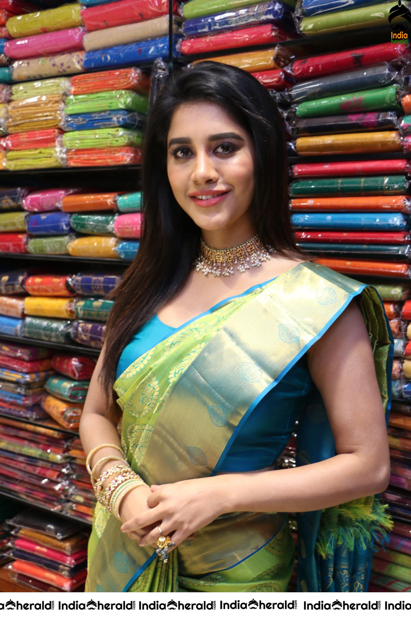 Nabha Natesh looking sexy in Saree during a Textile shop opening