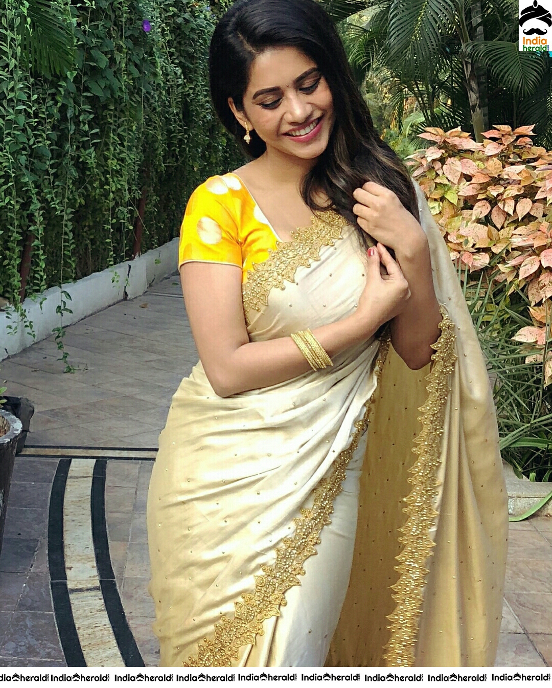 Nabha Natesh Looks So Cute In Golden Saree Stills