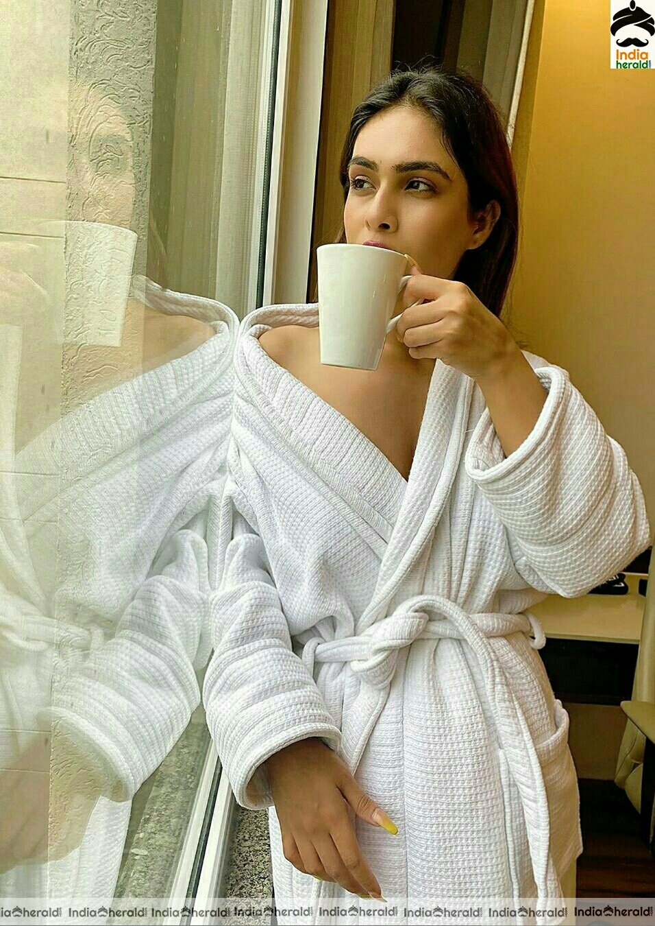 Neha Malik Hot In Bath Robe Stills